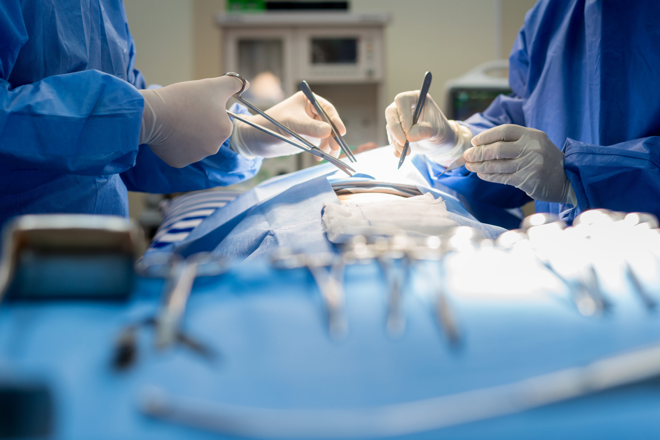 Doctors performing surgery on a patient in an operating room